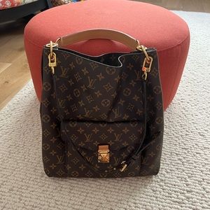 Louis Vuitton large purse/carry-on. Rarely used, like new, purchased in 2016